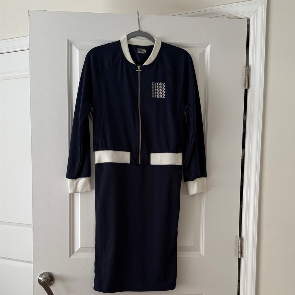 Stylish jersey jumper dress with white elastic trim. This dress is from Korea.